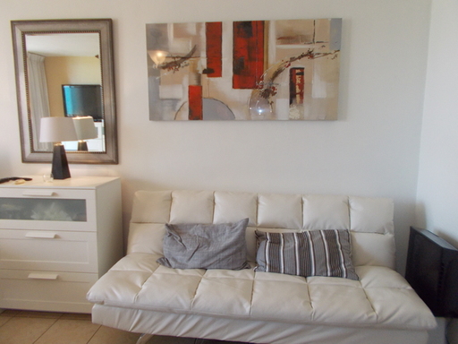 Living room area of studio for sale in Sunny Isles